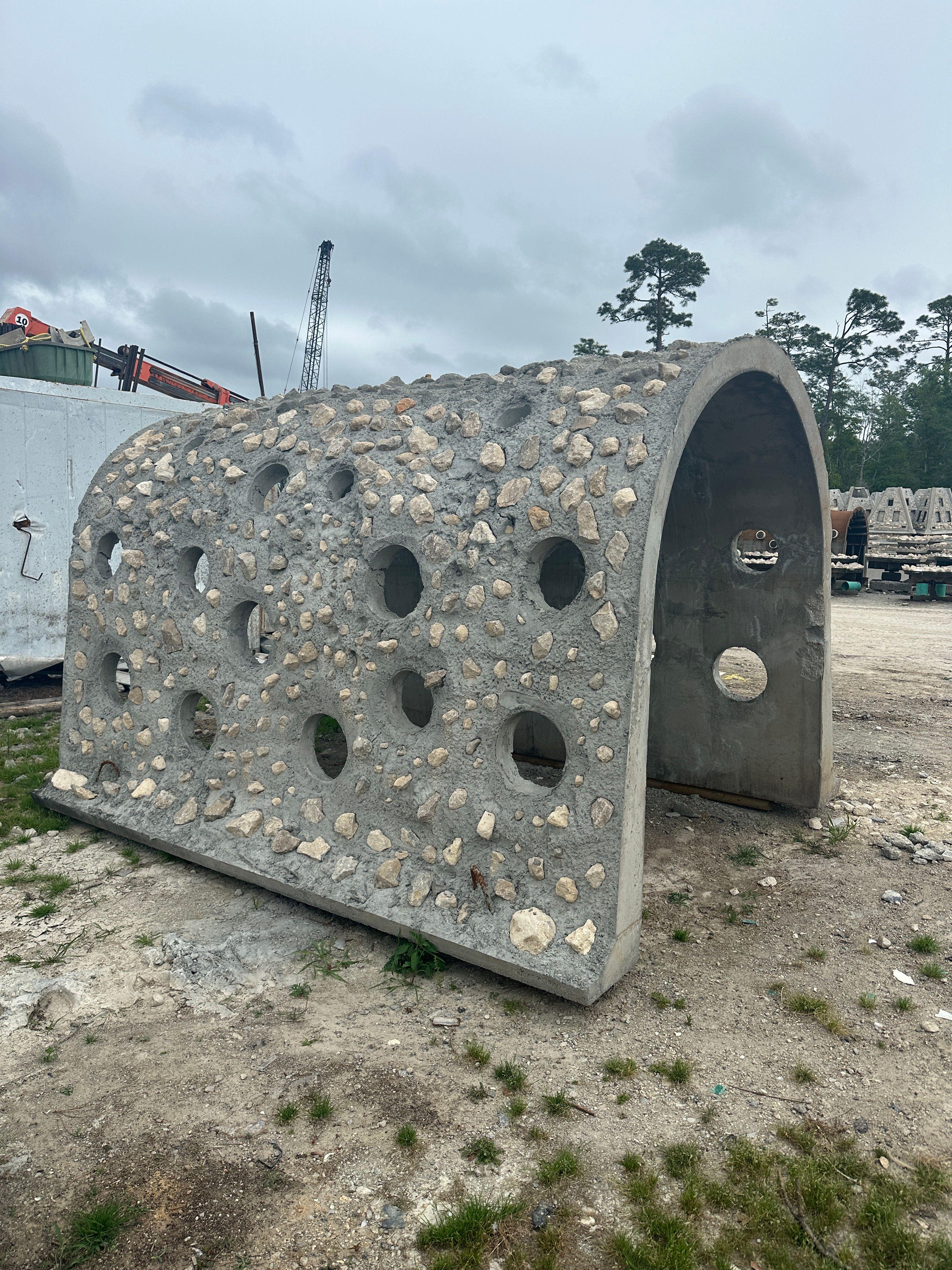 Custom cave reef design displayed on land before artificial reef deployment