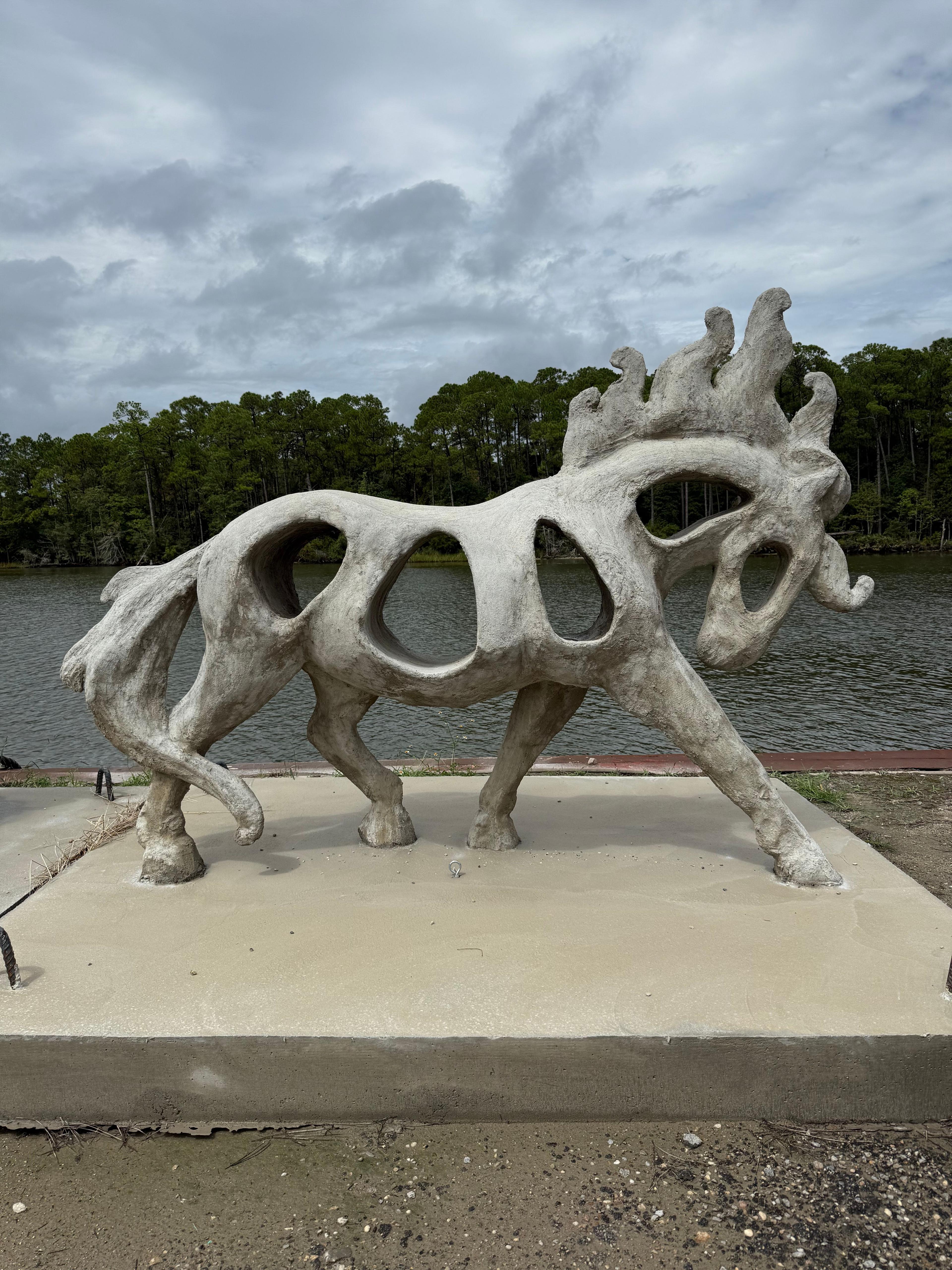 Artist-crafted horse reef sculpture displayed outdoors before deployment
