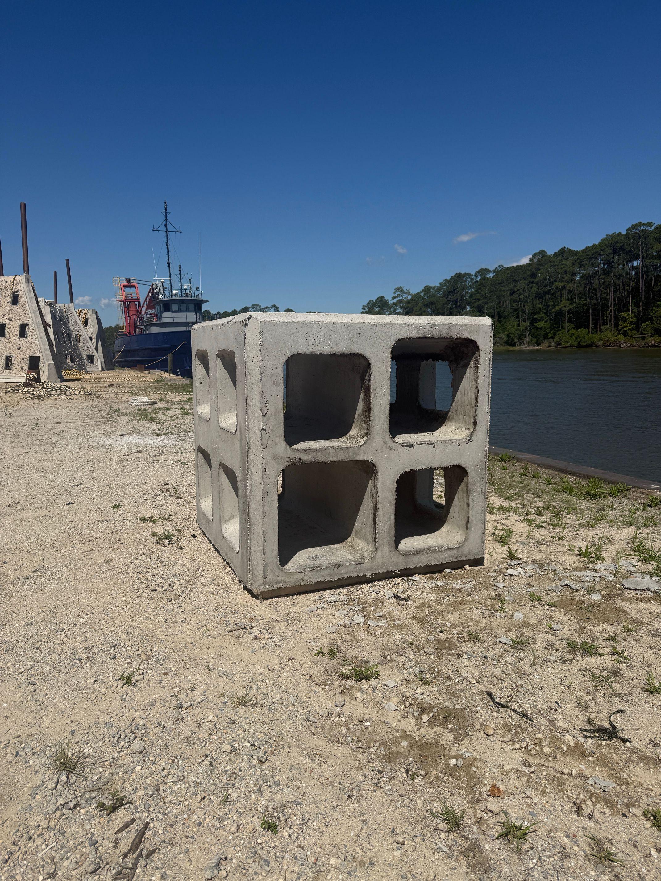 Concrete Marine Matrix artificial reef module positioned near the waterfront