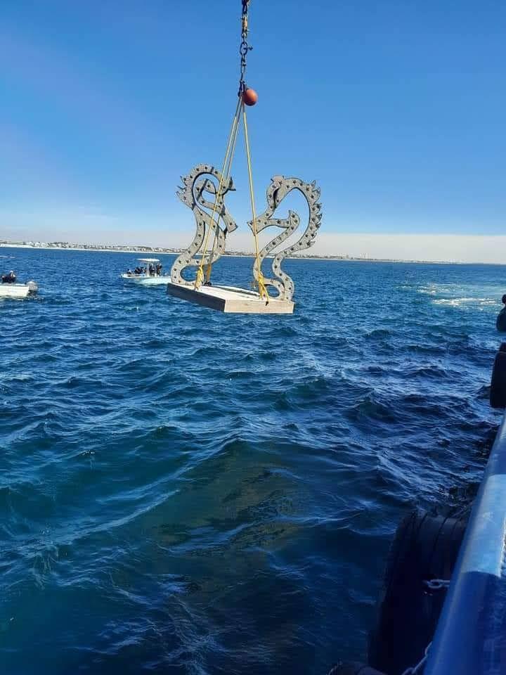 Dawn Dancers suspended above open water