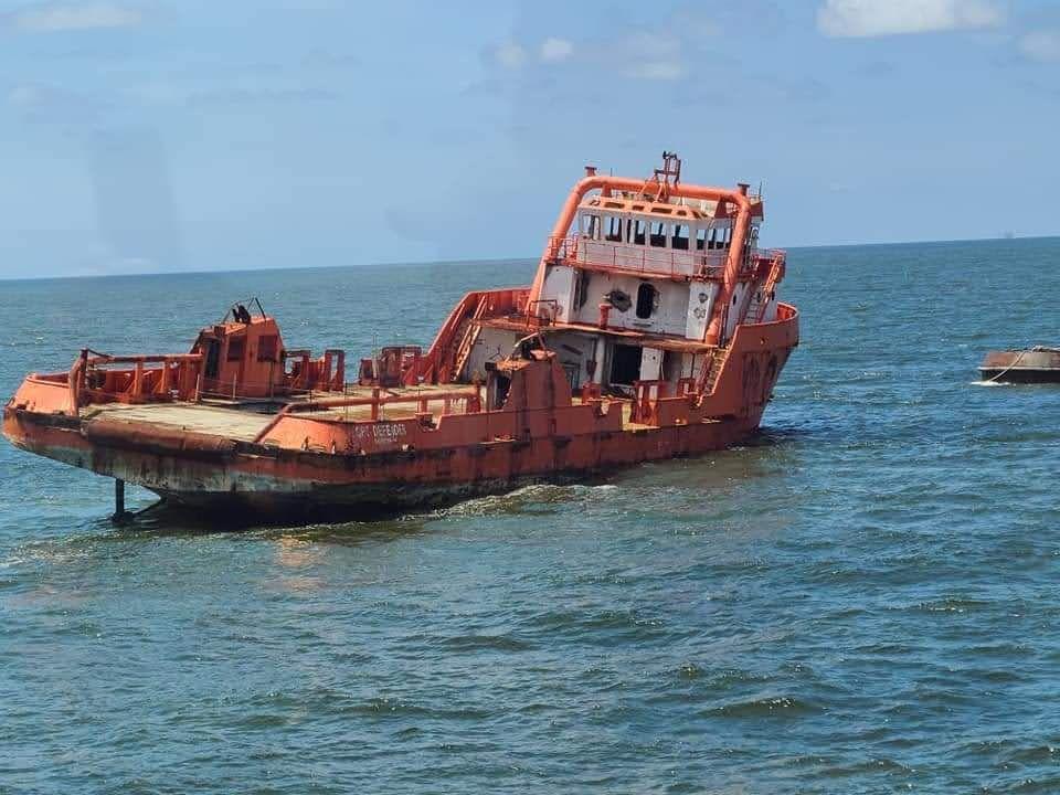 Orange vessel traveling to the designation for large vessel development project