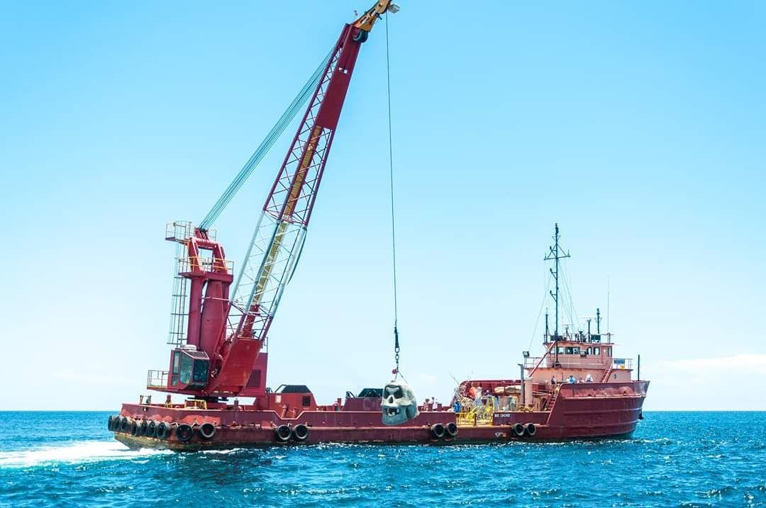 Large crane on a marine construction barge working offshore
