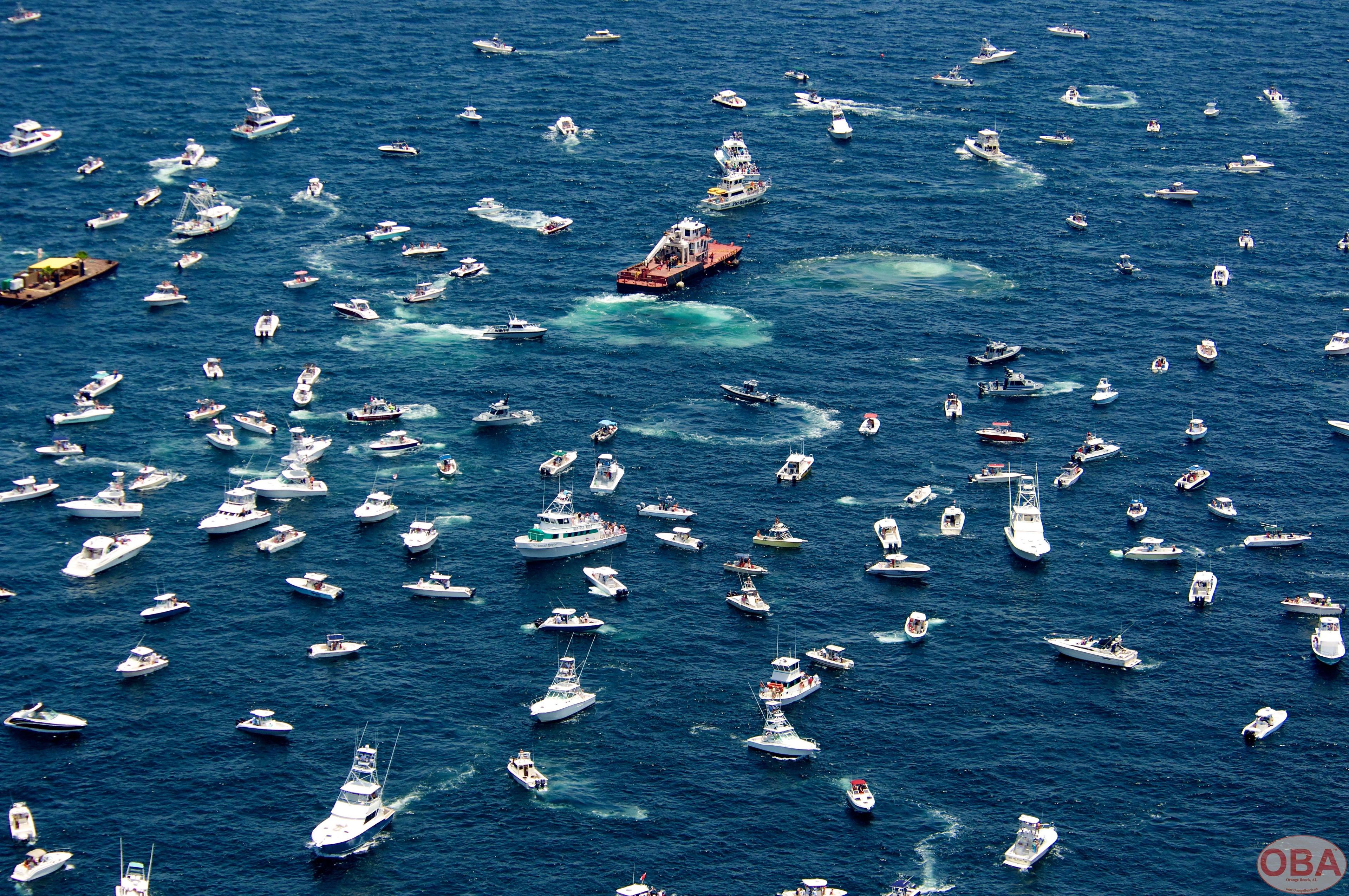Boats gathered above the site after the LuLu vessel became fully submerged