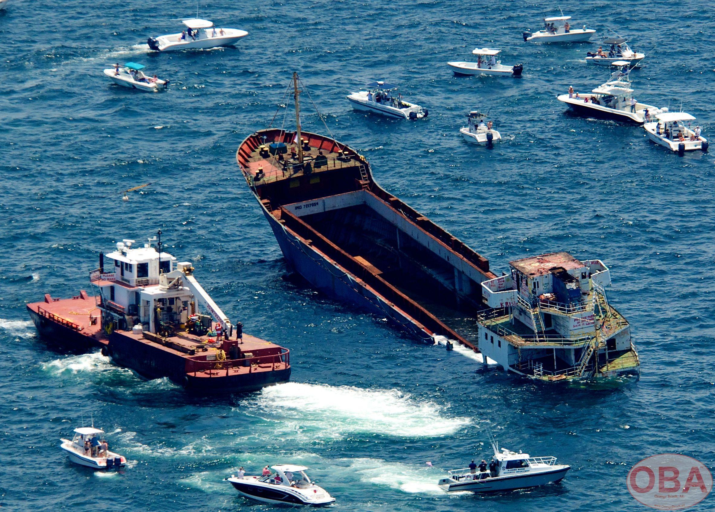 LuLu vessel taking on water as a tugboat remains nearby