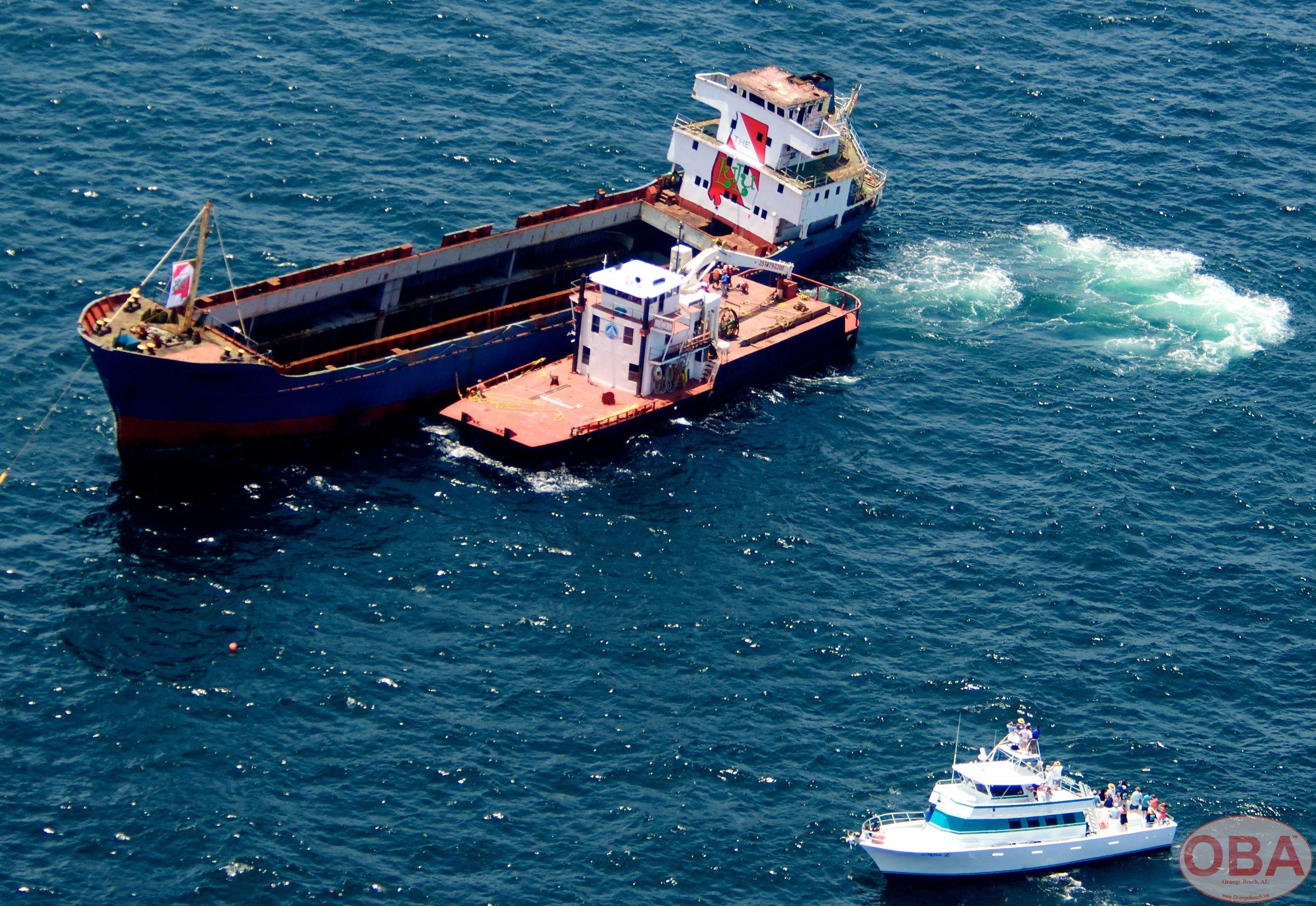 Tugboat positioned alongside the LuLu vessel during offshore preparations